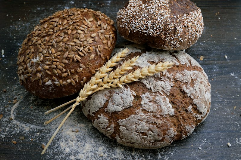 Freshly baked farm-style loaves on a rustic table