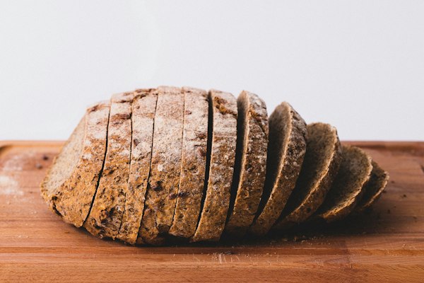 Freshly sliced farm loaf on a wooden board