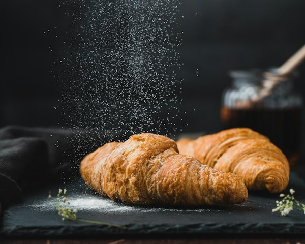 Freshly baked croissants dusted with flour